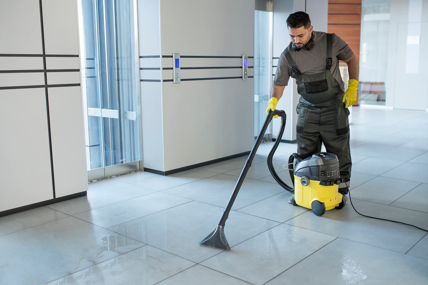 full shot man vacuuming office floor 23 2149345550